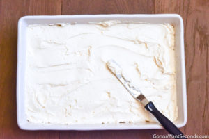 Step 7 How to make Cherry Delight recipe, spreading the cheesecake layer