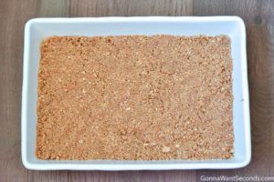 Step 2 How to make Cherry Delight recipe, pressing the crust in the baking dish