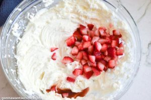 How to make strawberry jello cake strawberry buttercream frosting, adding strawberries to the mixture