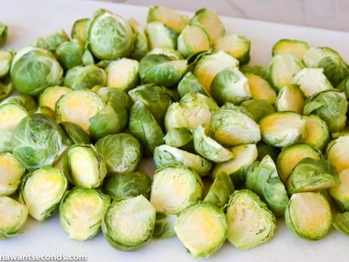 How to make Cheesy Roasted Brussels Sprouts, cutting in half