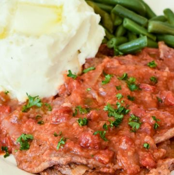 Swiss Steak with mashed potato and green beans on the side