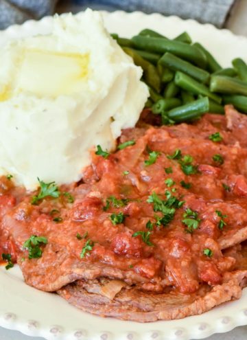 Swiss Steak with mashed potato and green beans on the side
