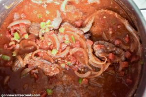 How to make Swiss Steak, cooking the steak in sauce