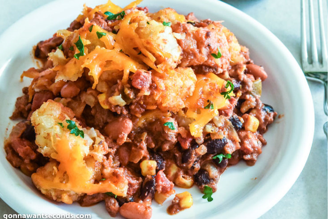 cowboy casserole with beans on a plate, top shot