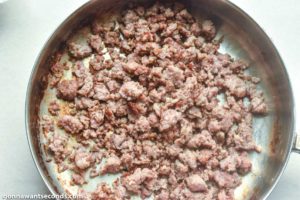 How to make Spaghetti Stuffed Garlic Bread, browning the sausage