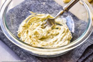 How to make Spaghetti Stuffed Garlic Bread, mixing garlic butter spread