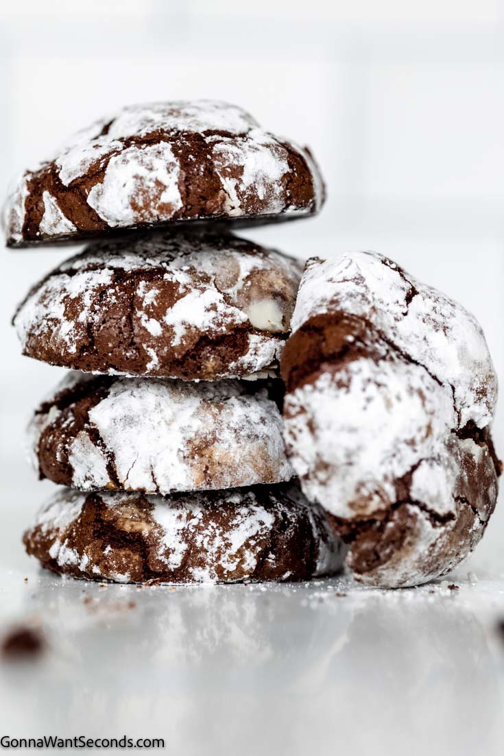 chocolate crinkle cookies stack on top of each other