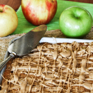 Apple Bars in a baking sheet with caramel glaze on top