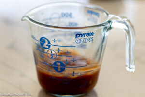 how to make brown sugar meatloaf, Mix all the topping ingredients in a liquid measuring cup