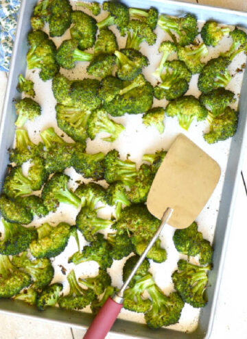 oven roasted broccoli on a baking sheet