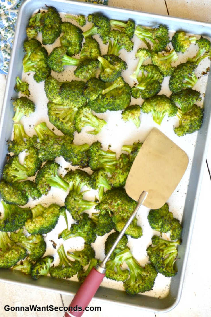 oven roasted broccoli on a baking sheet