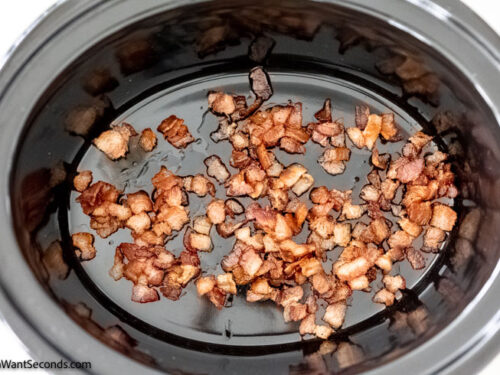 how to make easy slow cooker chicken cacciatore step 2, transfering the bacon to the crockpot