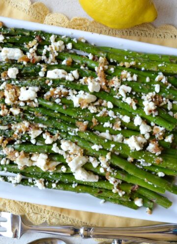 Our Roasted Garlic Asparagus with Feta Is Tossed In A Garlic Lemon Marinade And Roasted To Caramelize Flavors In The Asparagus Then Topped With Feta!
