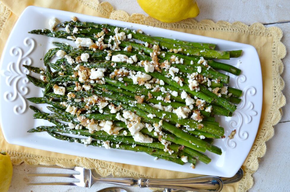 Our Roasted Garlic Asparagus with Feta Is Tossed In A Garlic Lemon Marinade And Roasted To Caramelize Flavors In The Asparagus Then Topped With Feta!