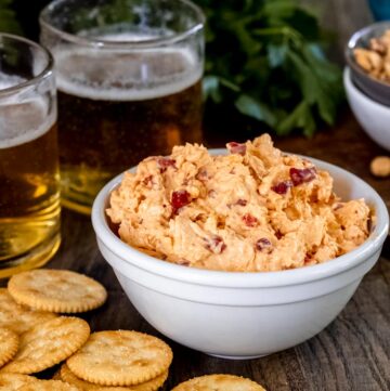 Pimento Cheese in a bowl with crackers on the side