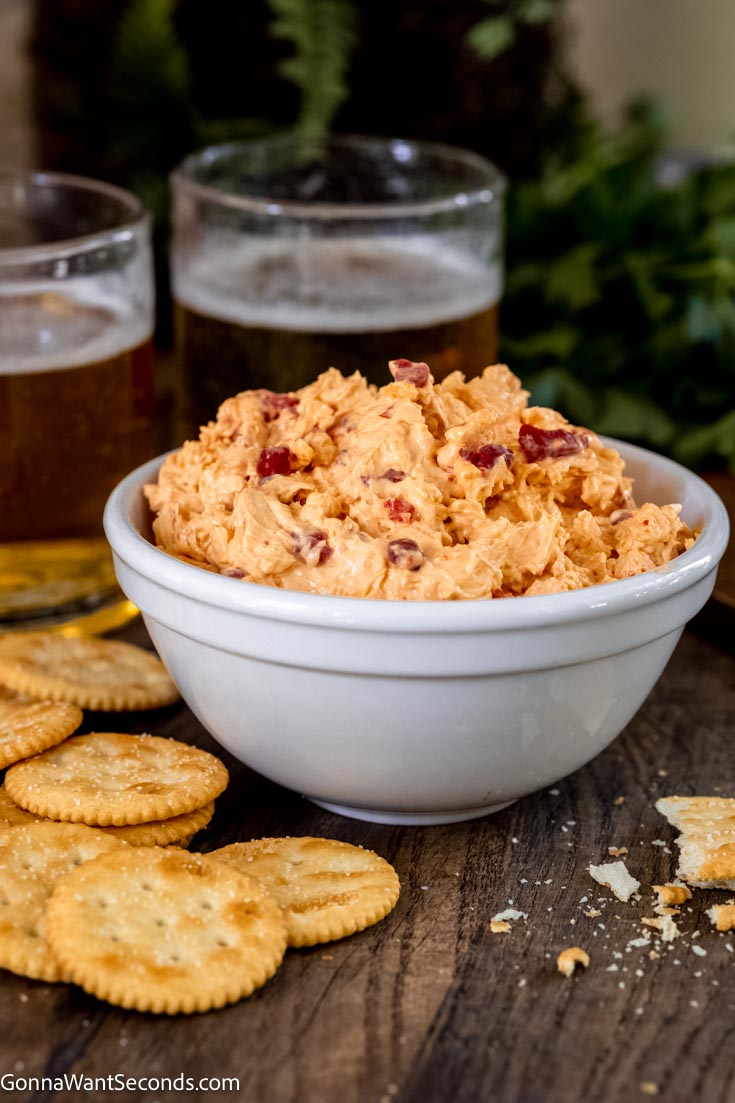 easy pimento cheese recipe in a bowl with crackers on the side 