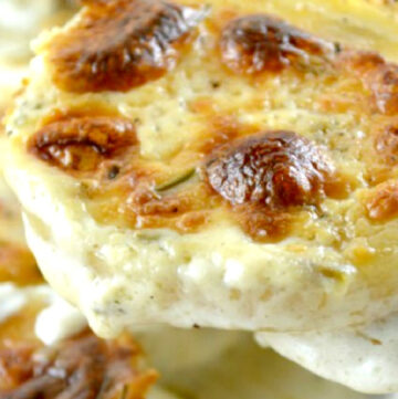 Scooping boursin cheese scalloped potatoes