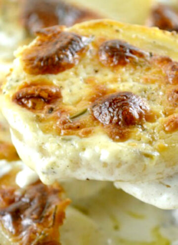 Scooping boursin cheese scalloped potatoes
