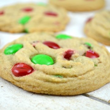 Soft Batch Christmas M&M Cookies on a white wooden table