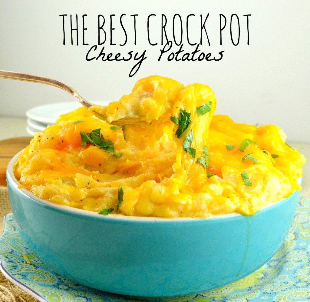 Spoon scooping Crockpot Cheesy Potato in a blue bowl