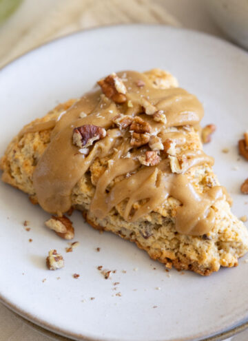 A slice of maple pecan scones on a plate