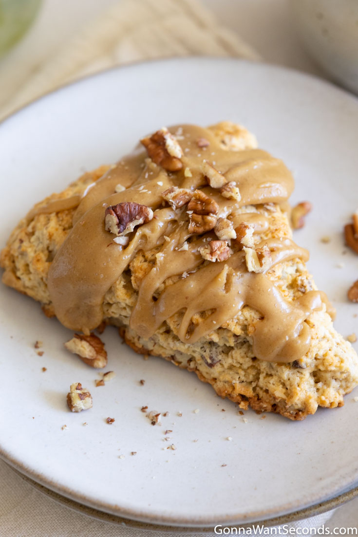 A slice of maple pecan scones on a plate