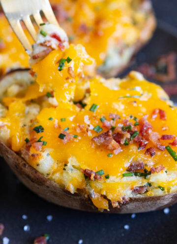 twice baked potatoes topped with melted cheese and bacon