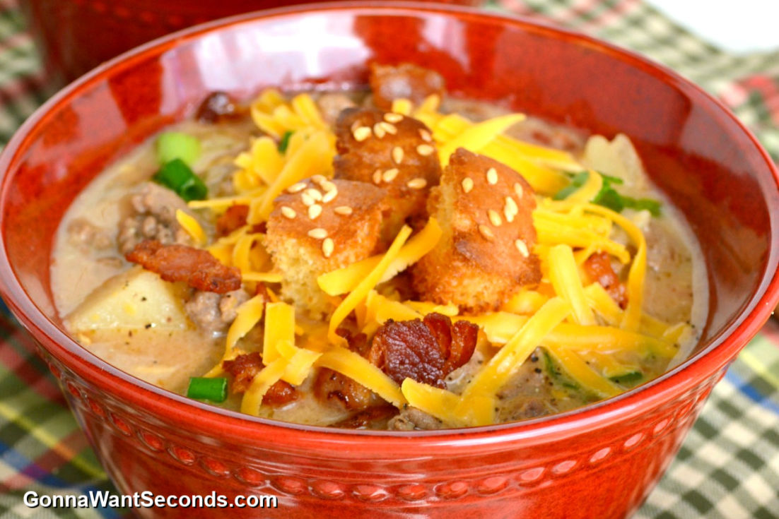 a bowl cheeseburger soup with croutons and cheese on top