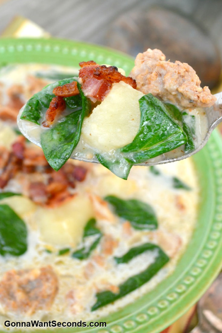 close up of a spoonful of Olive Garden zuppa toscana soup