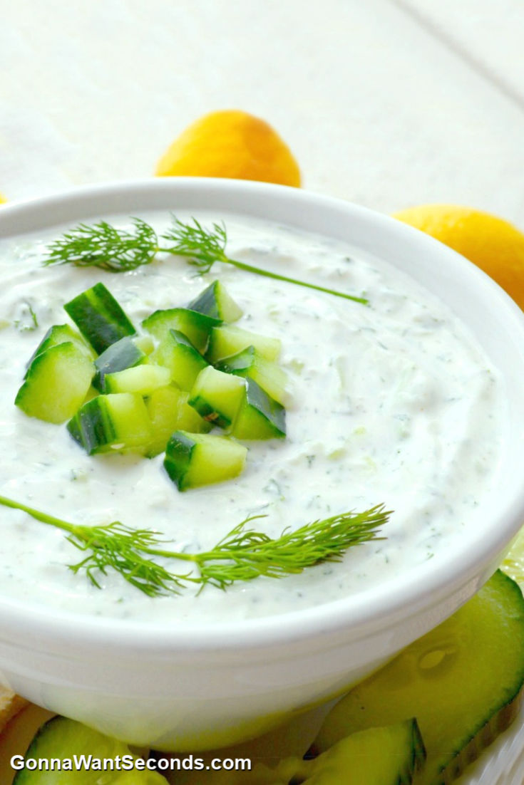 tzatziki sauce topped with chopped cucumber and dill