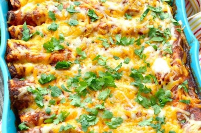 Cheesy chicken enchiladas recipe in a blue casserole dish