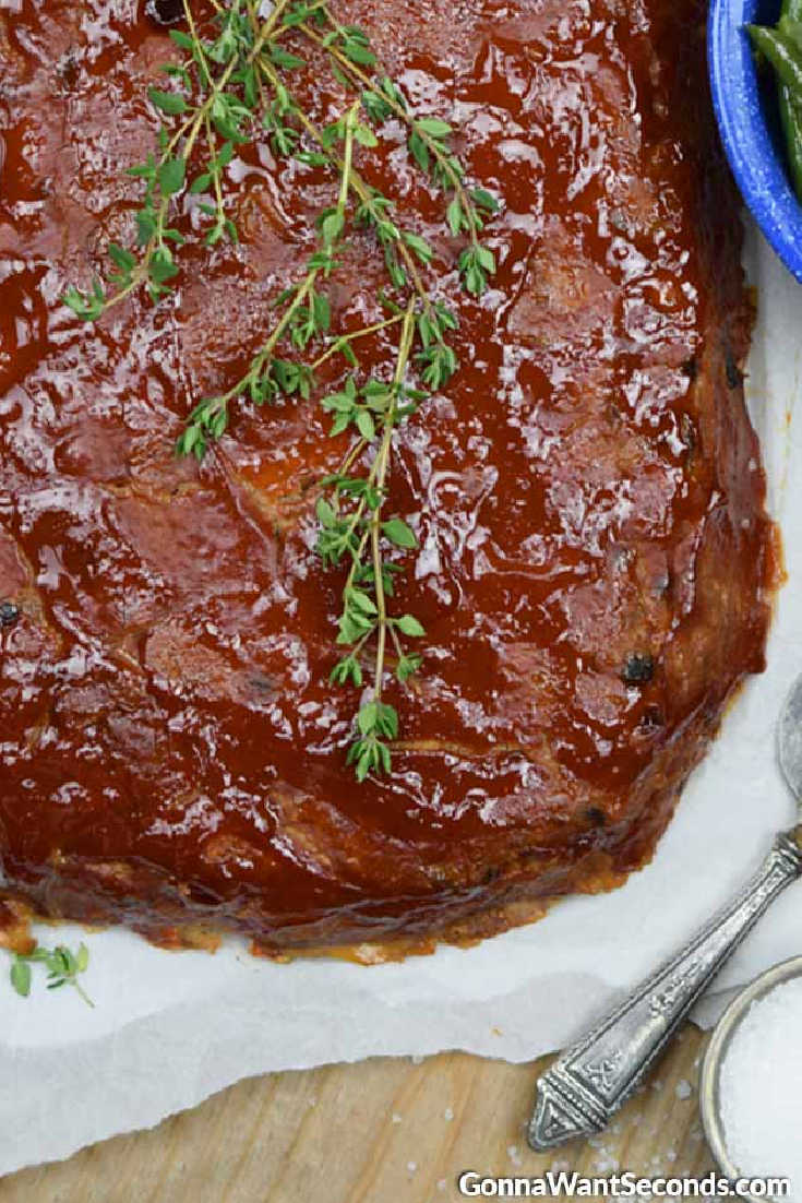 moist turkey meatloaf garnished with thyme leaves on top