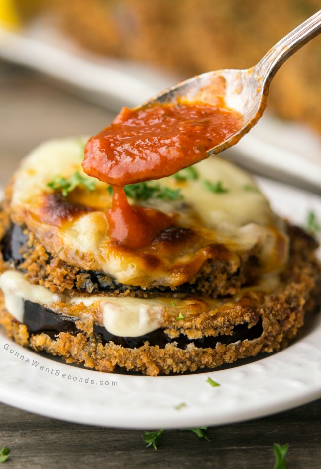 Fried Eggplant topped with melted mozzarella poured with marinara sauce