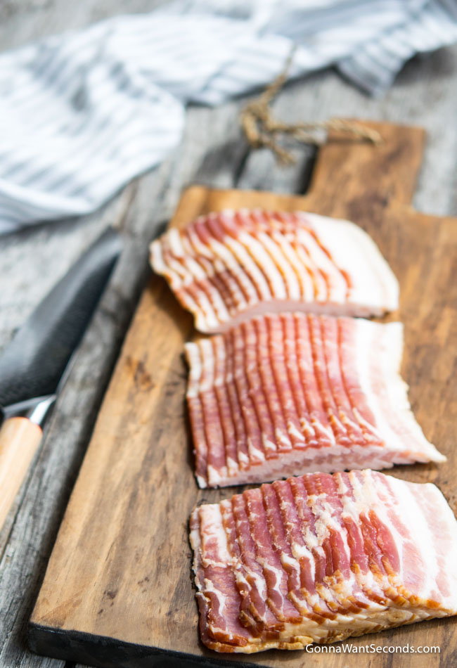 Bacon slices on a wooden chop board