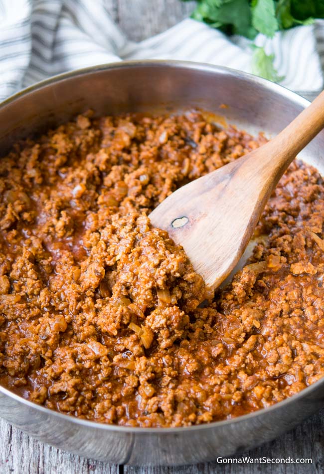 Ground Turkey Taco Meat in Skillet with Wooden Spoon