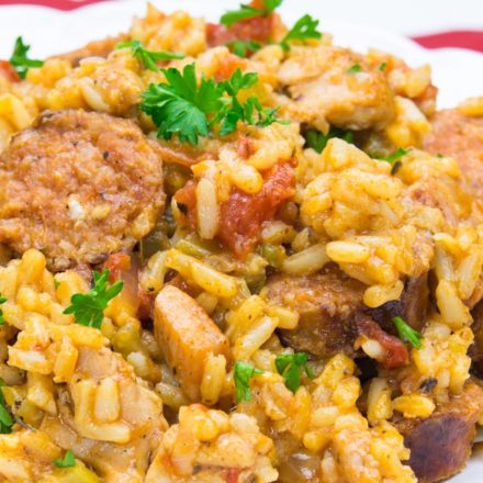 Jambalaya topped with chopped parsley on a plate