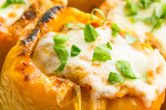 Italian Stuffed Peppers topped with melted mozzarella cheese