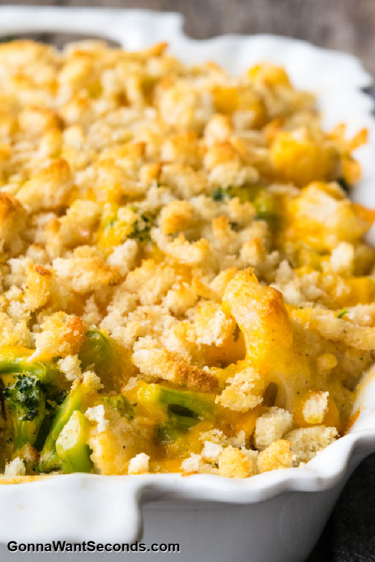 broccoli and cauliflower casserole topped with cheese and breadcrumbs