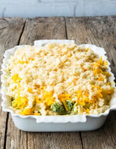 Step 9 how to make broccoli cauliflower casserole, Sprinkle top with cheese and breadcrumbs.