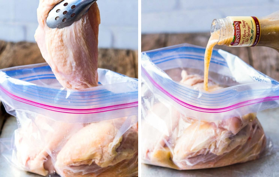 Placing chicken breasts and Italian dressing in a resealable plastic bag.