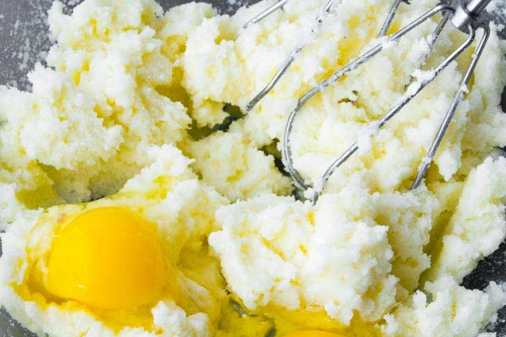 Mixing egg with butter and sugar