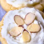 Almond Cookies with frosting and sliced almonds on top