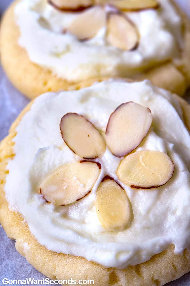 Almond Cookies with frosting and sliced almonds on top