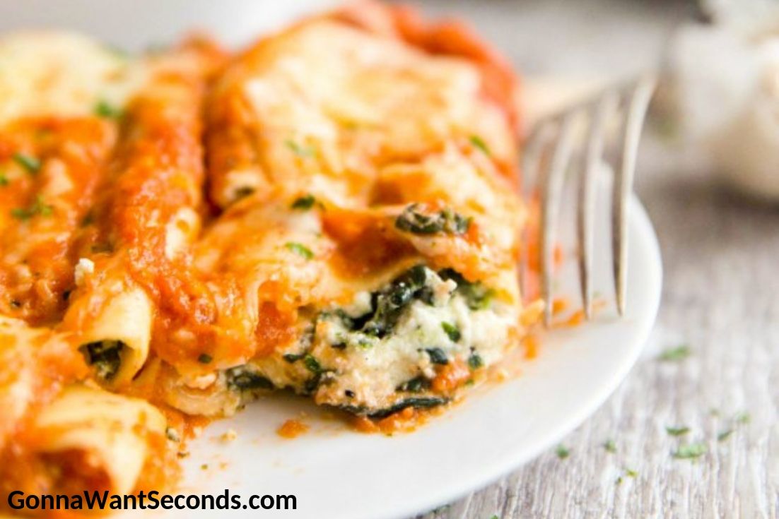 Cannelloni on a plate with fork on the side