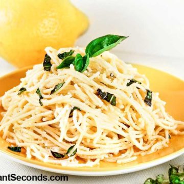 Lemon Garlic Pasta topped with fresh basil on a plate