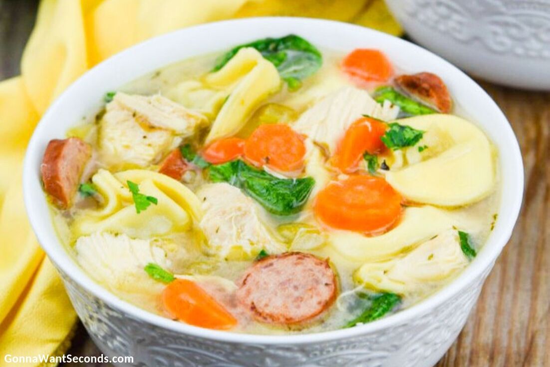 Chicken Tortellini Soup in a white bowl