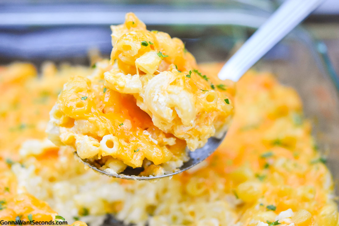 Scooping Paula Deen Mac and Cheese from the casserole dish