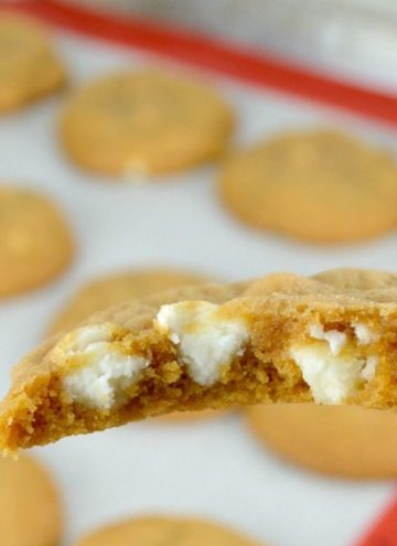 Pumpkin Spice Cookies cut in half, showing white chocolate chips inside