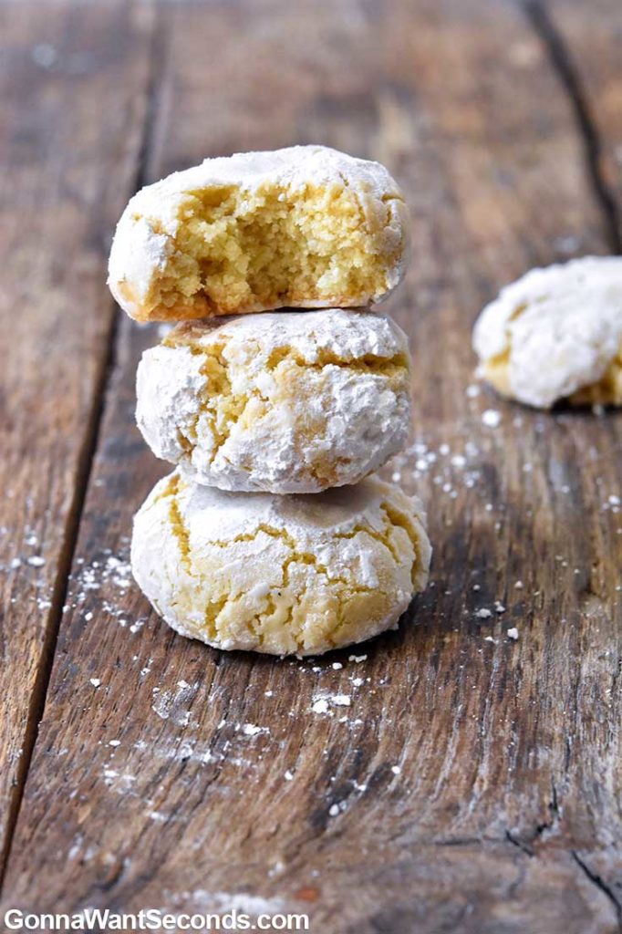 Amaretti cookies stack on top of each other, on a wooden table