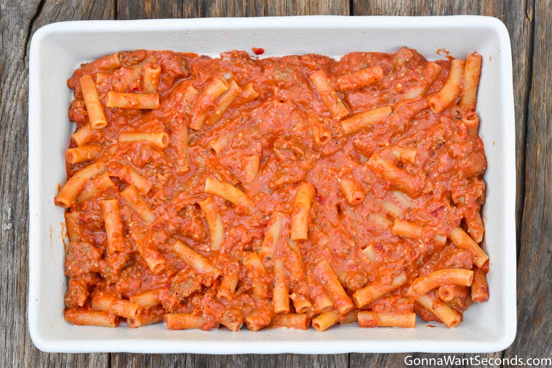 step by step how to make baked ziti with sausage, a layer of pasta with sauce in a casserole